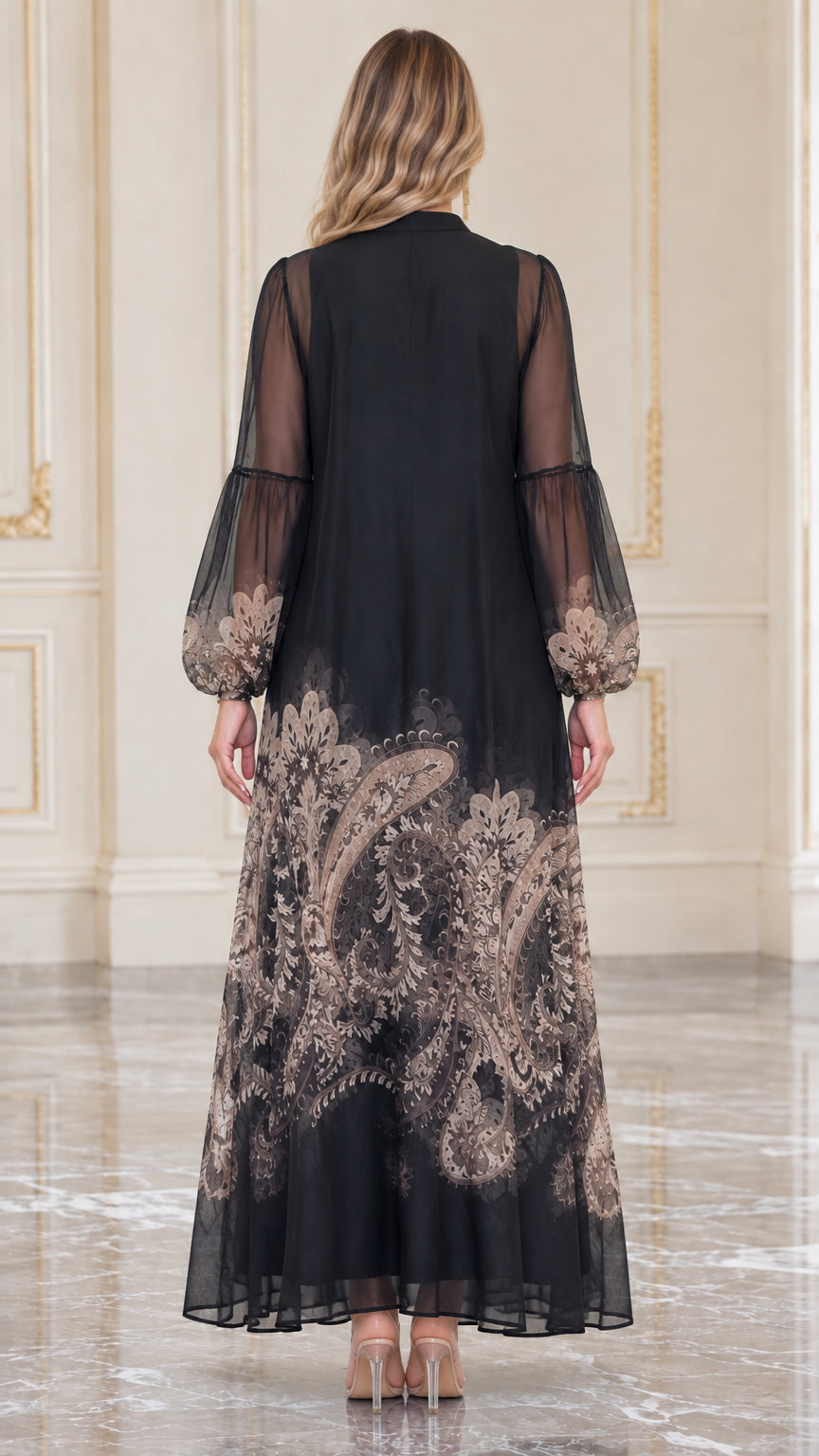 Back view of black A-line paisley border print maxi dress