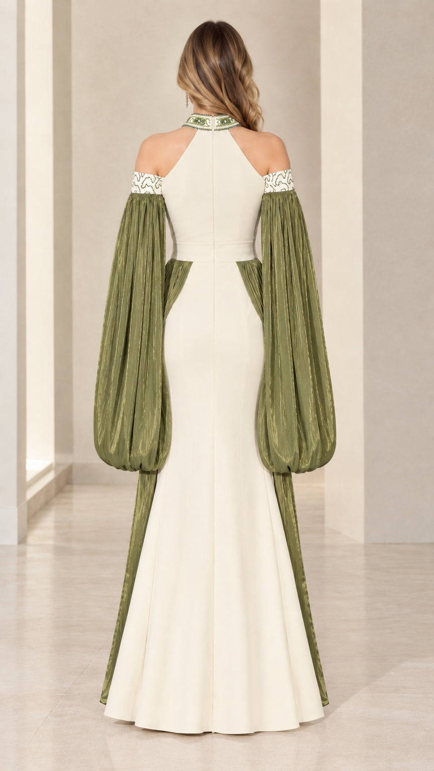 Back view of model in ivory and olive halter evening gown with cut-out back