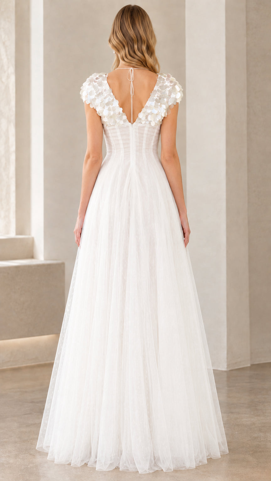 Back view of white V-neck tulle evening dress showing low tie back