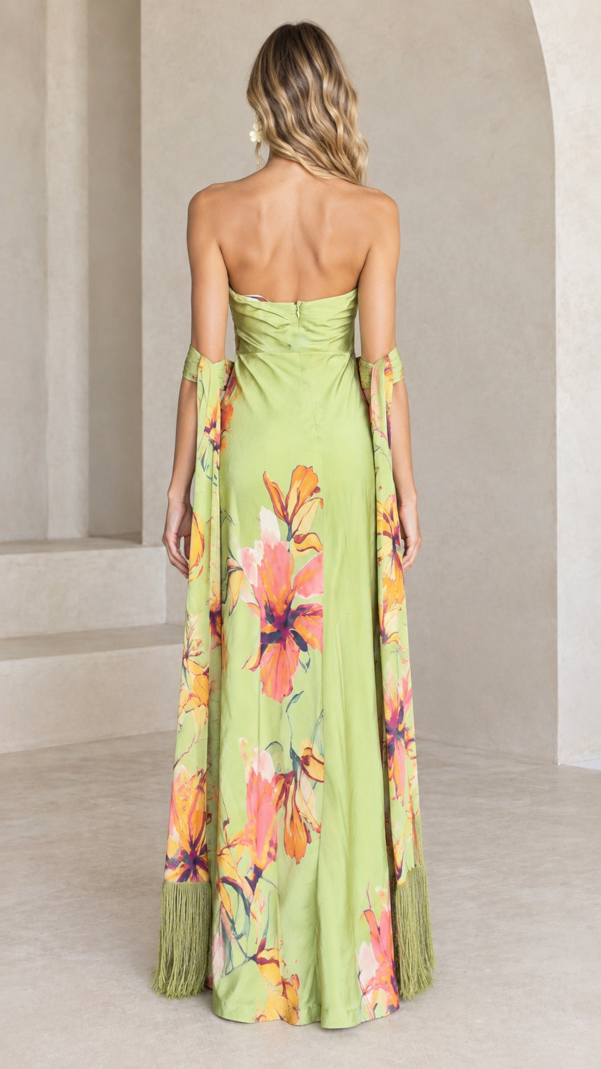 Back view of lime green strapless floral maxi dress showing zip closure