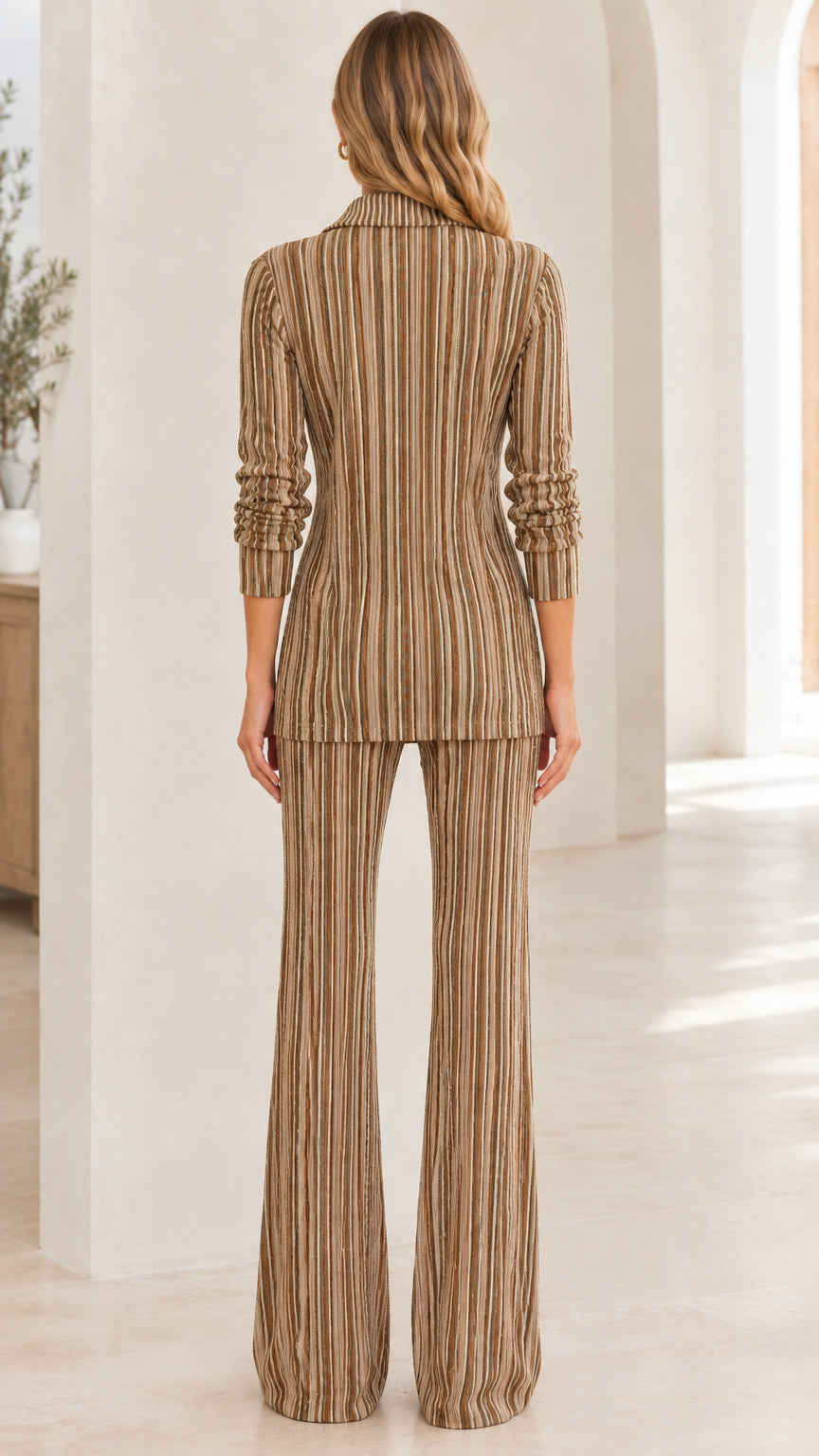 Back view of woman wearing Camel striped ribbed knit collared top and flare pants