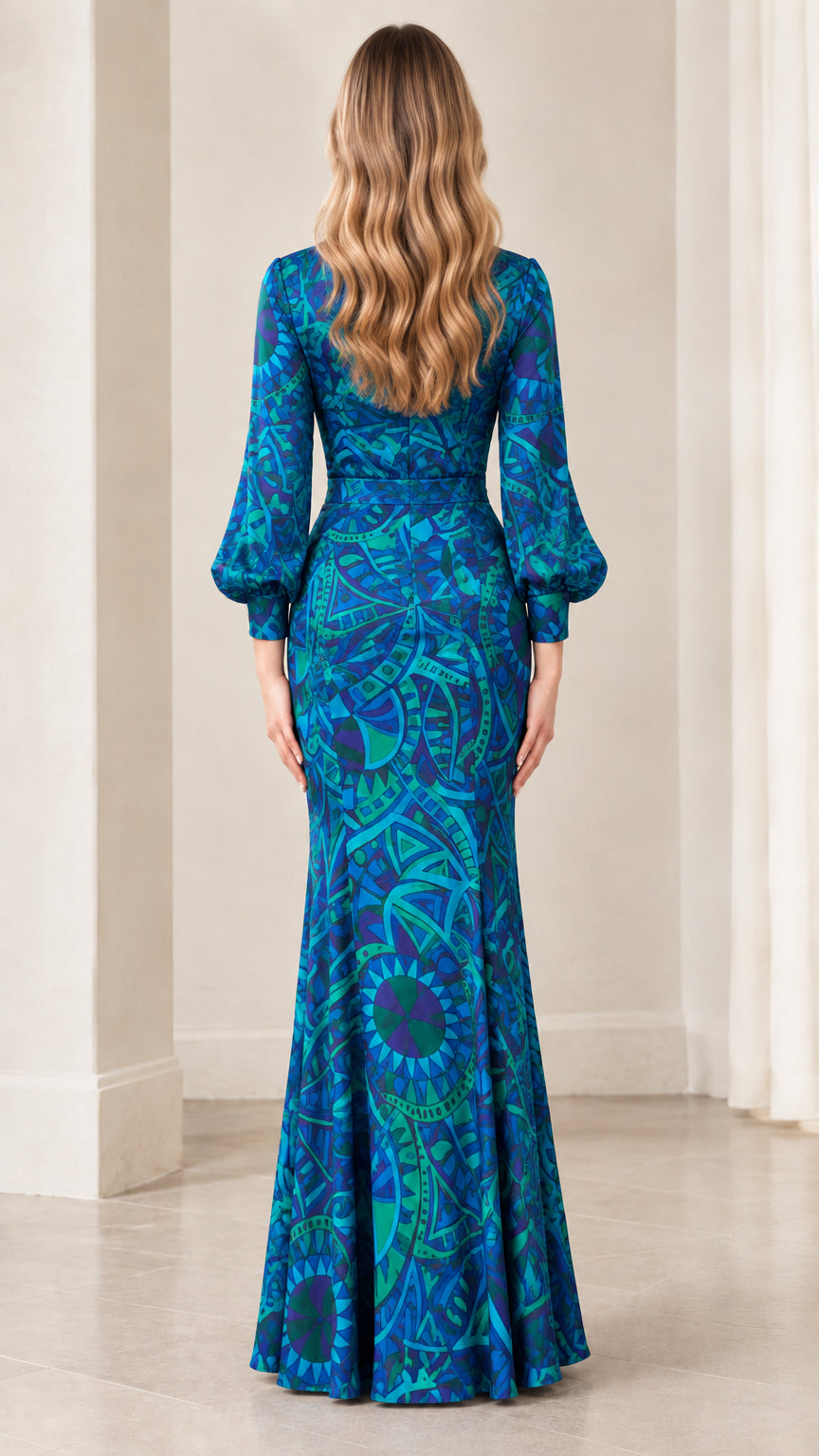 Back view of model in royal blue printed floor-length mermaid gown