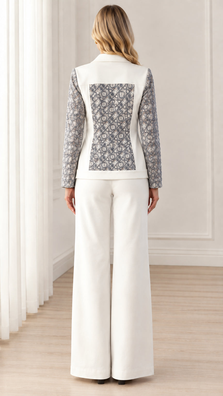 Back view of women's white blazer featuring geometric jacquard back panel and matching pants