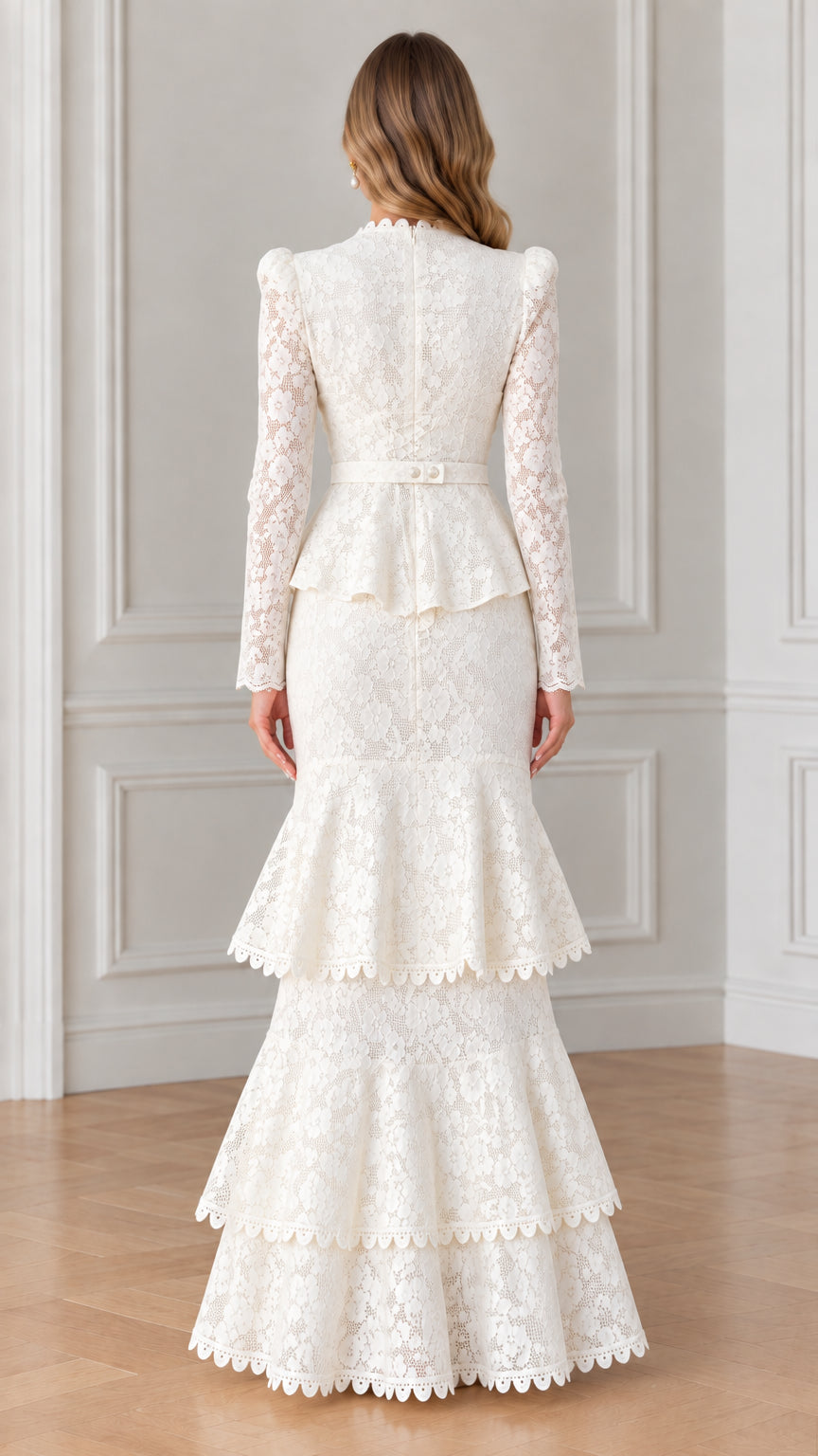 Back view of woman wearing white long sleeve lace evening gown with peplum waist