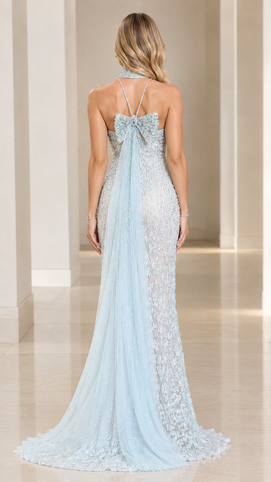 Ice blue evening gown back view showing back bow and sheer train