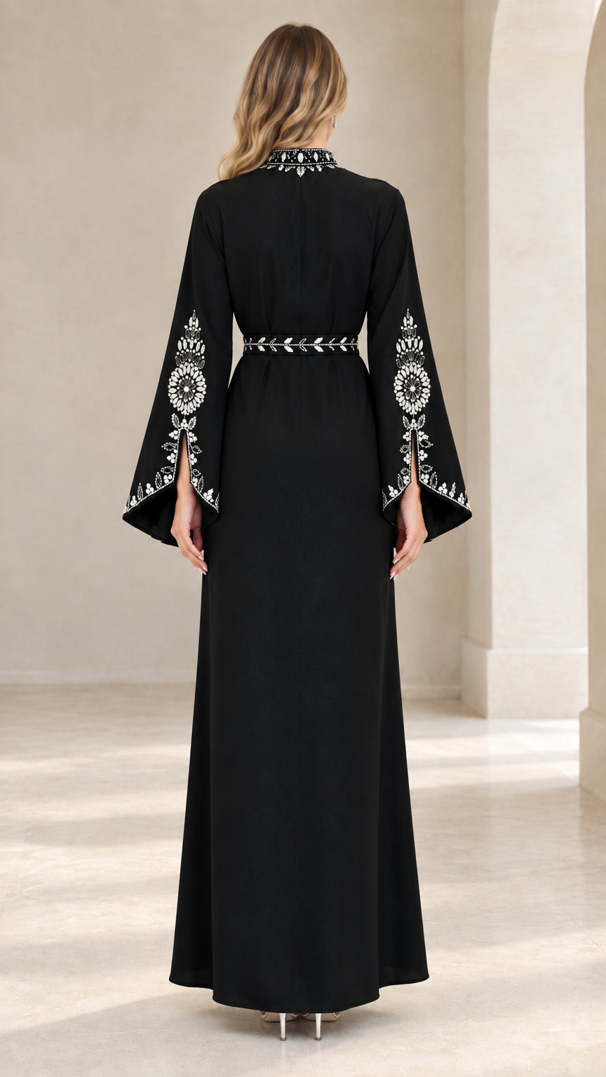 Back view of woman wearing black elegant abaya maxi dress with crystal trim