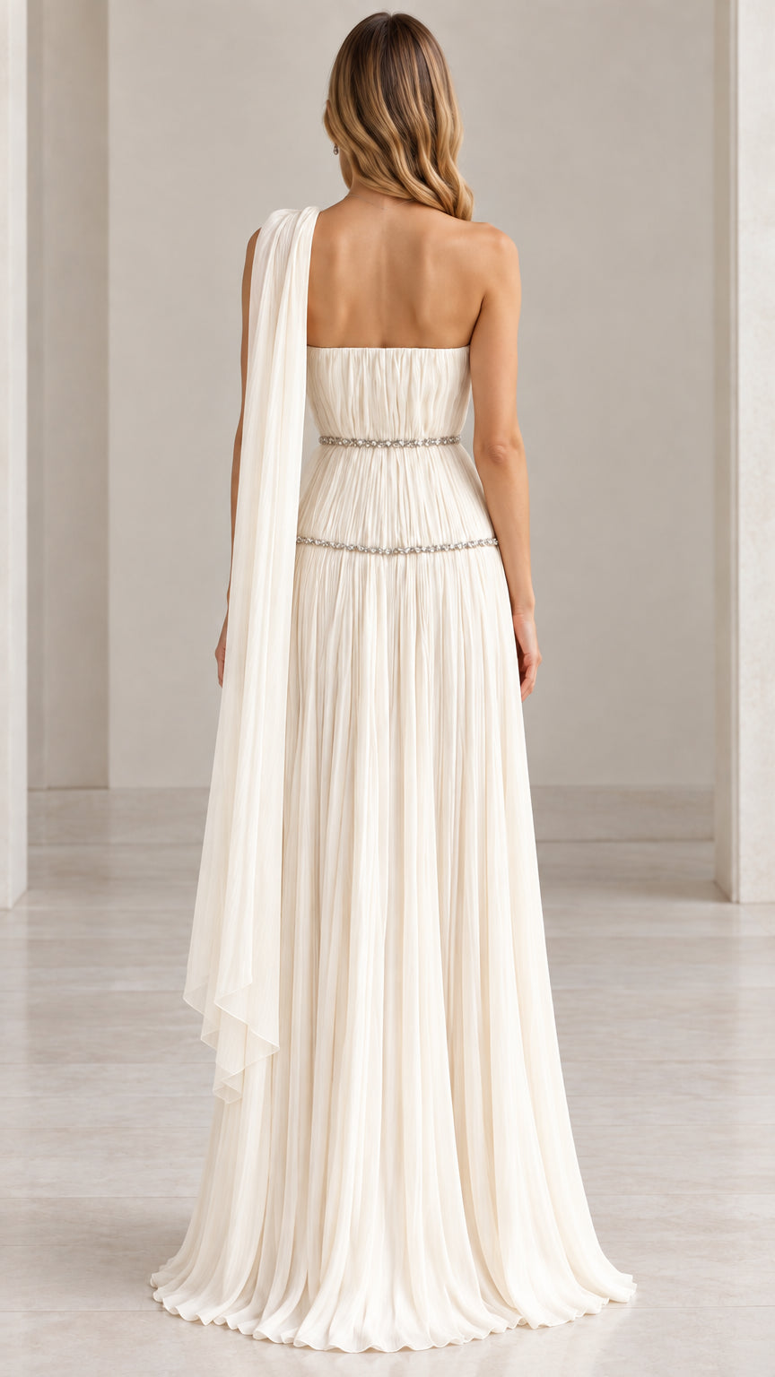 Back view of ivory strapless evening gown showing attached cascading shoulder scarf