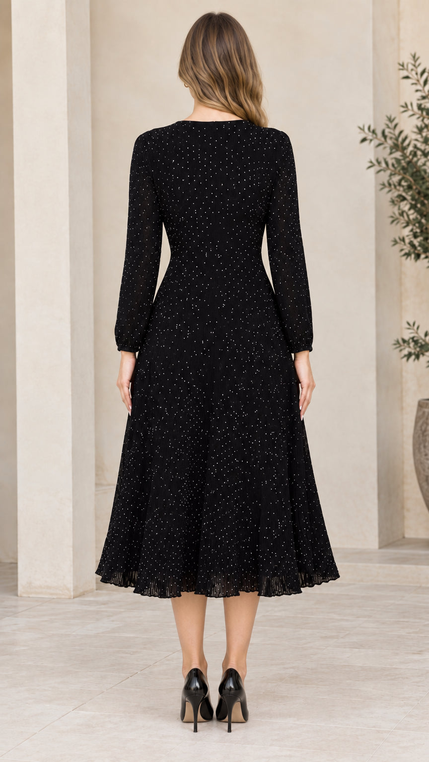 Back view of woman wearing black long sleeve midi dress with concealed zipper