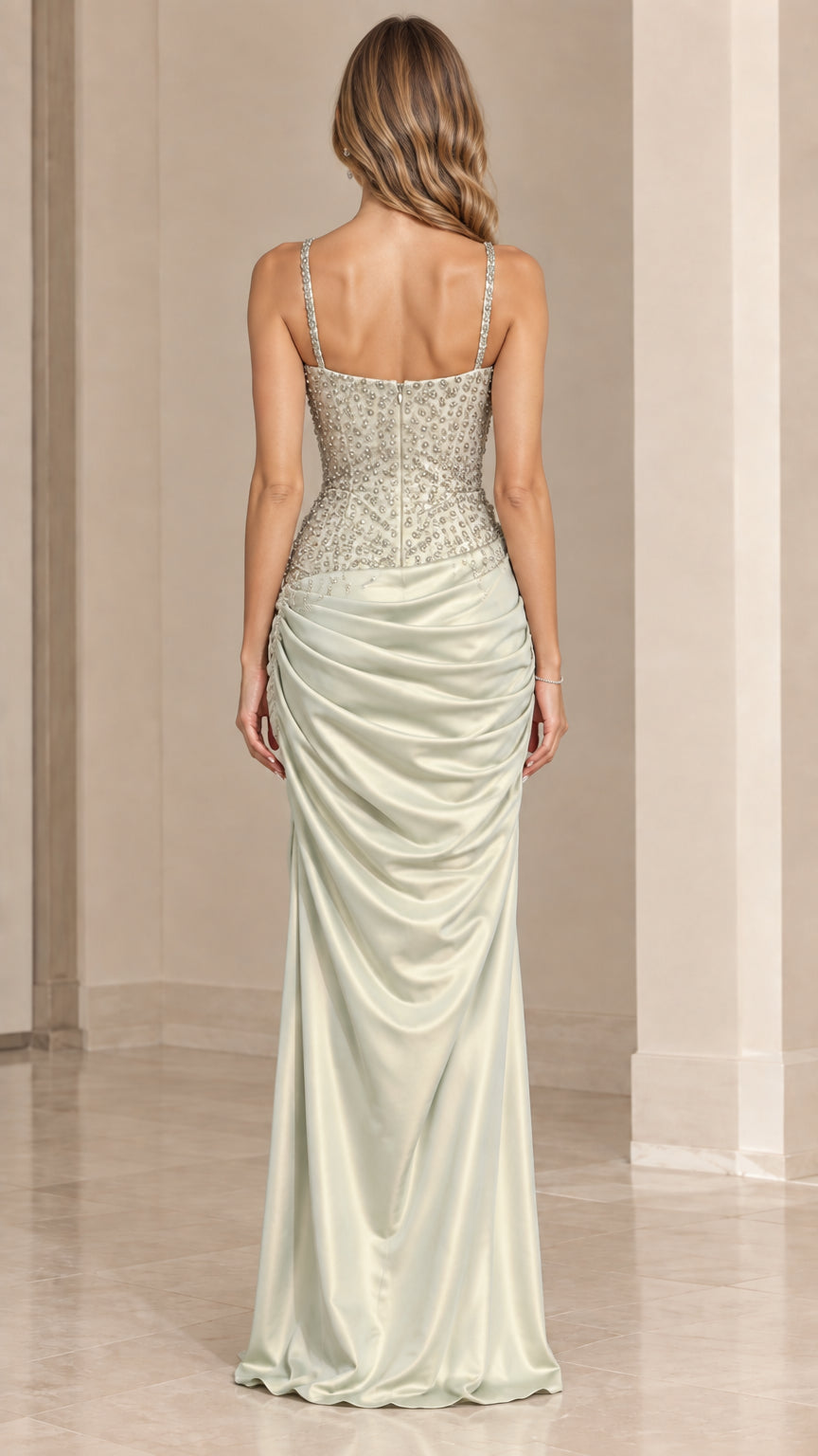 Back view of model in sage green corset back evening gown