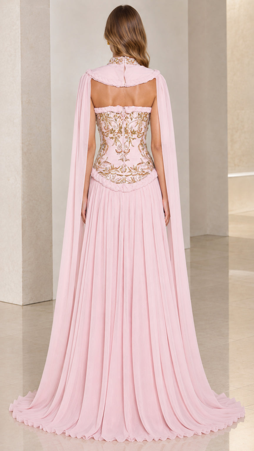 Back view of blush pink strapless gown with trailing sheer cape