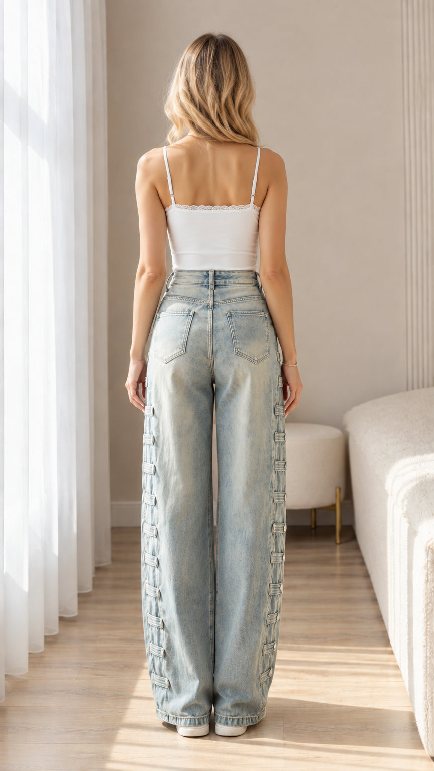 Back view of woman wearing vintage washed light blue wide-leg jeans