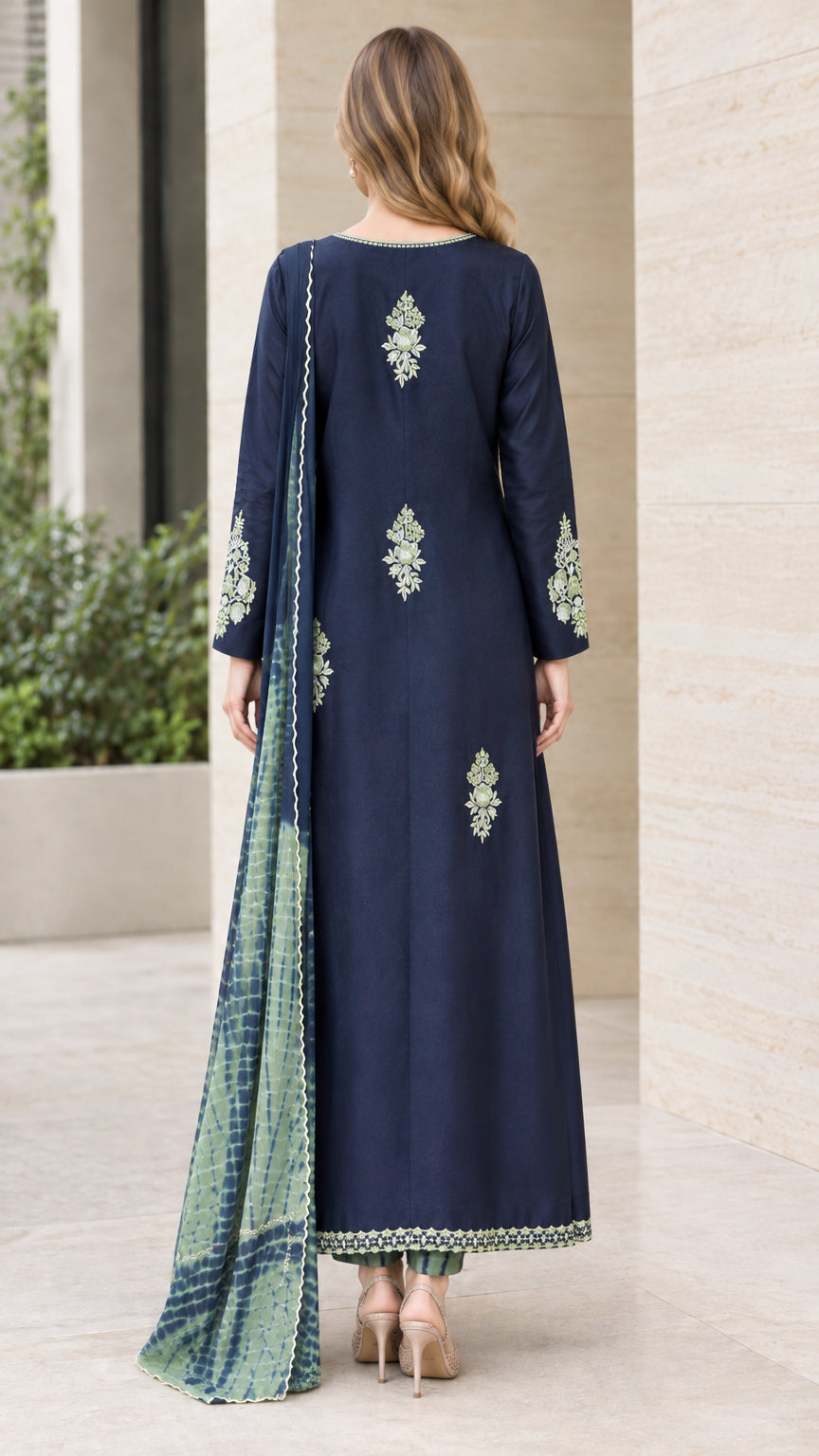 Back view of woman wearing Navy Blue embroidered kurta set showing back detail