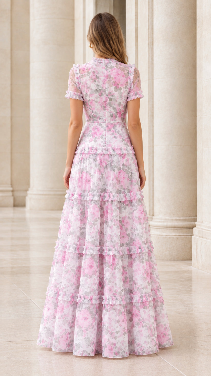 Back view of the pink floral ruffle tiered maxi dress showing waist and tiers