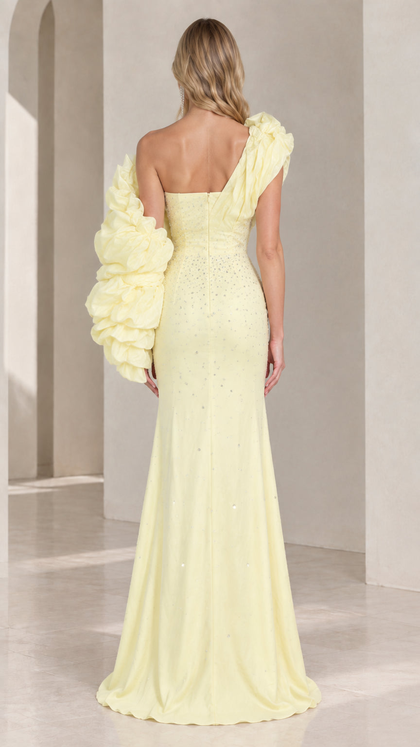 Back view of light yellow embellished one-shoulder evening gown