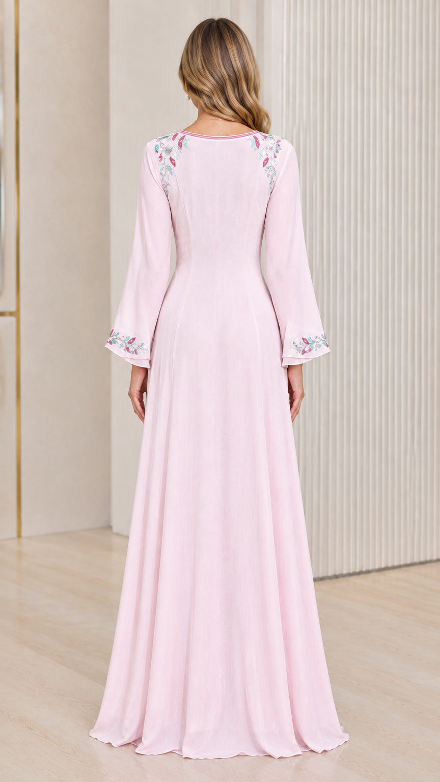 Back view of woman wearing Light Pink long sleeve maxi gown