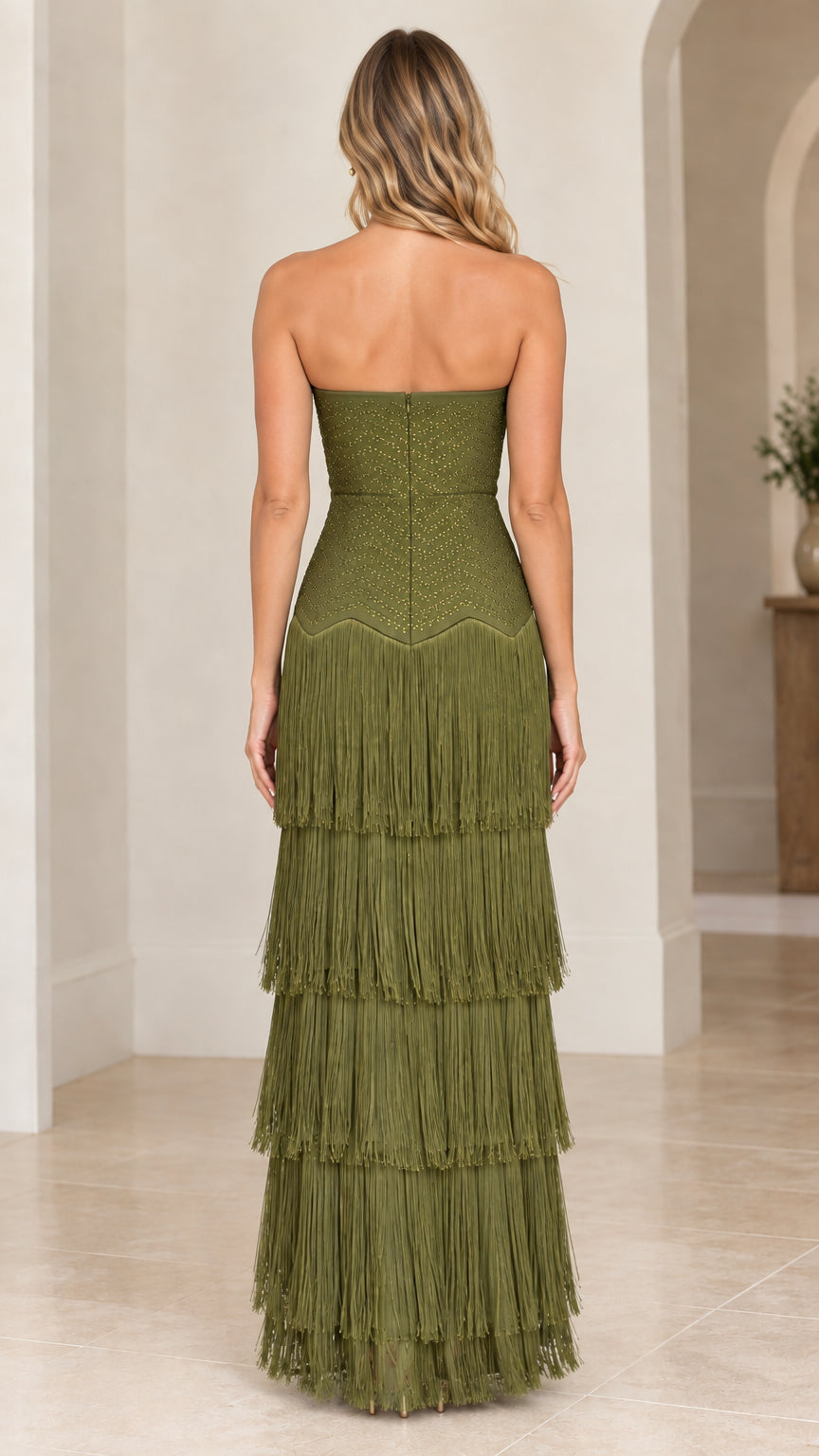 Back view of woman wearing olive green strapless tiered fringe evening dress