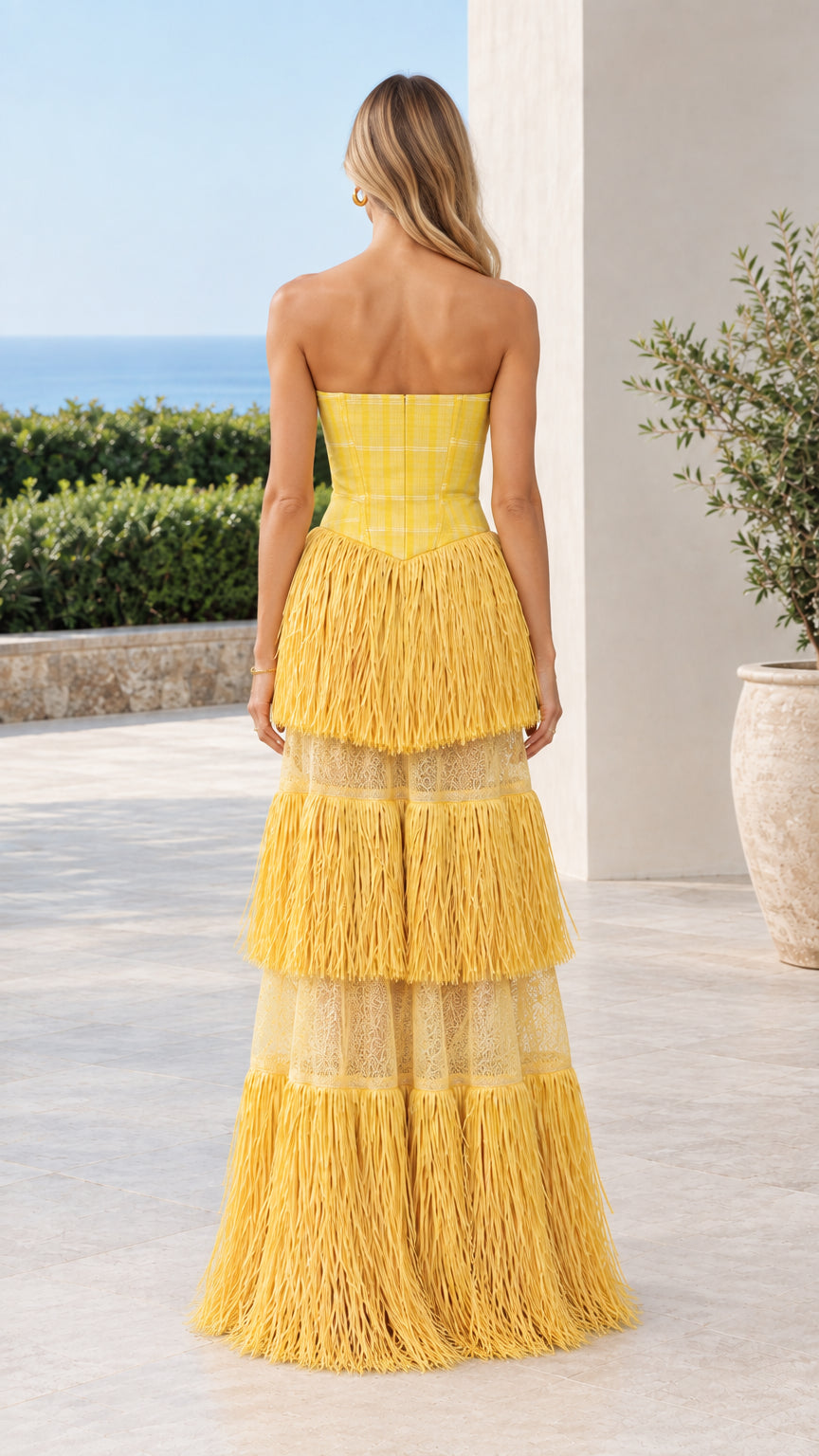 Back view of model in Yellow Strapless Plaid Corset Tiered Fringe Maxi Dress