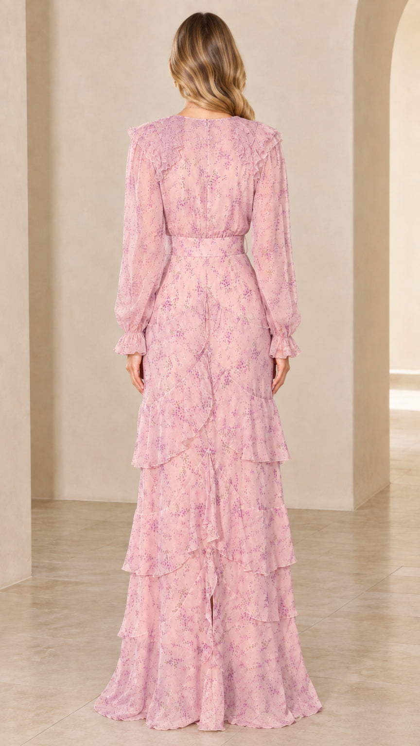 Back view of model in blush pink long sleeve floral maxi dress