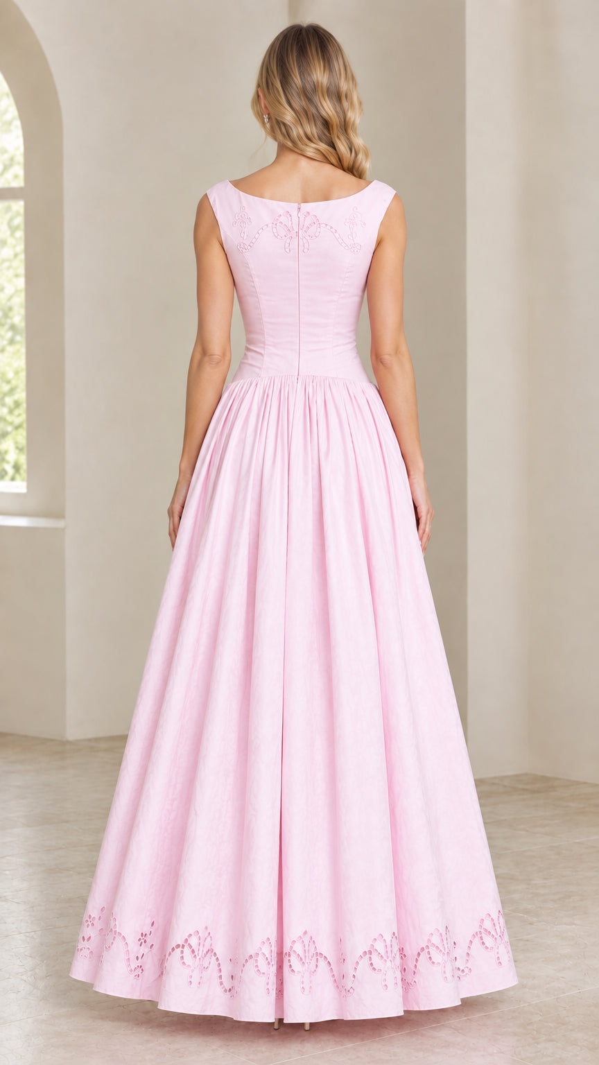 Back view of model wearing Light Pink embroidered full-length dress