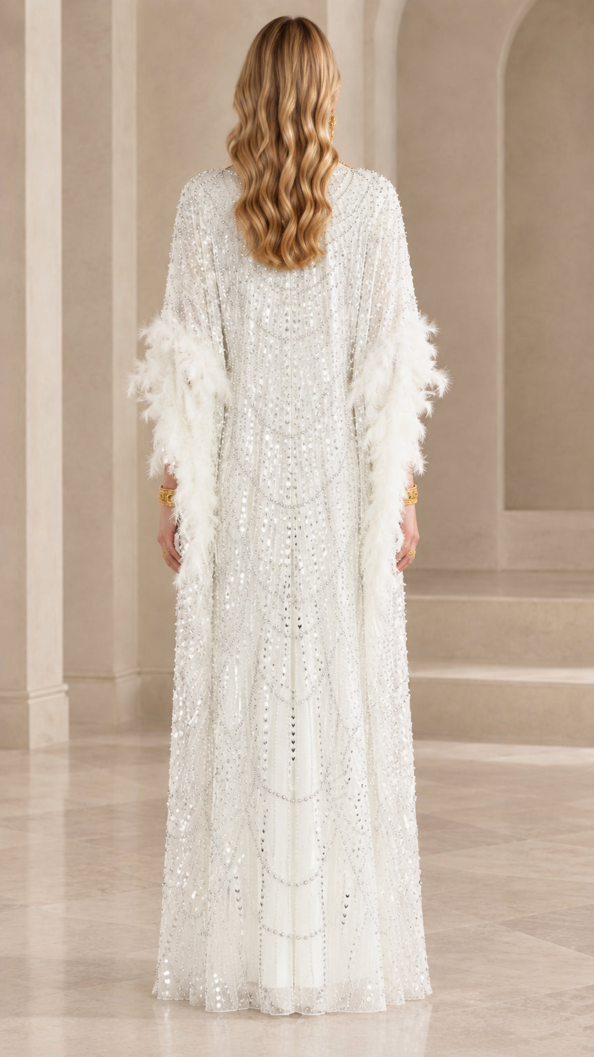 Back view of model wearing white full-length sequin kaftan gown