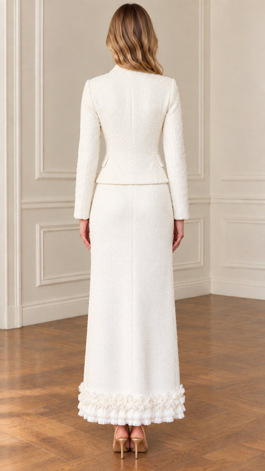 Back view of ivory tweed tailored jacket and maxi skirt outfit