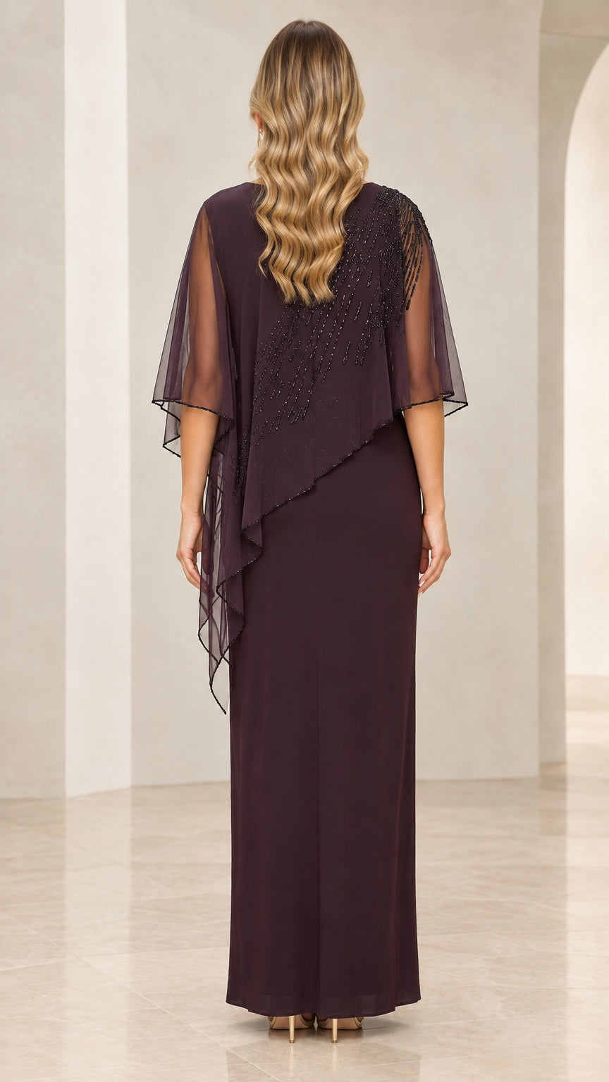 Back view of model wearing Plum floor-length capelet dress