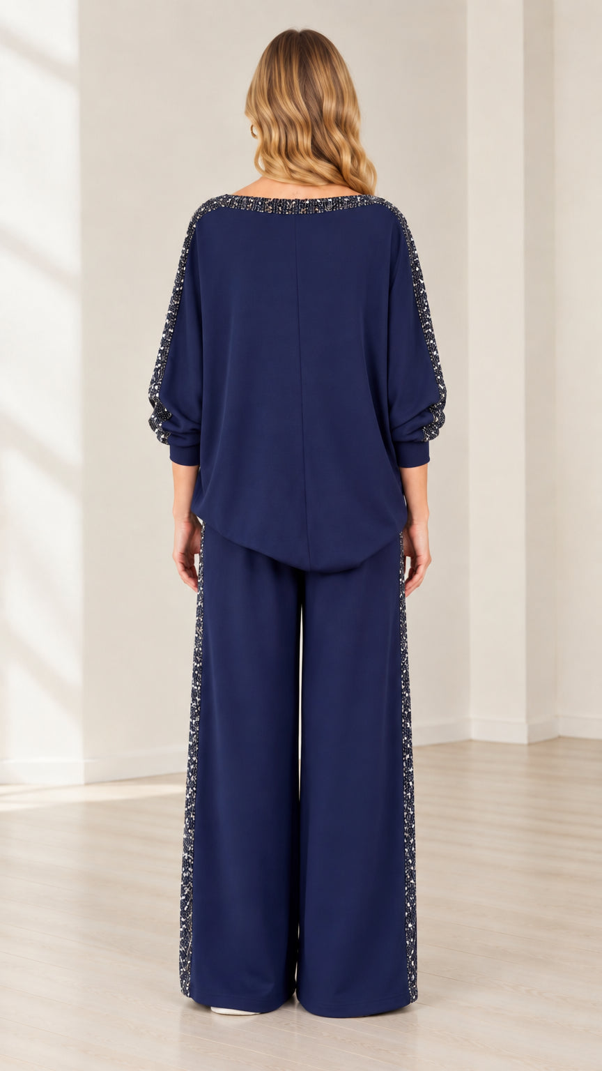 Back view of navy blue two-piece lounge set showing relaxed silhouette