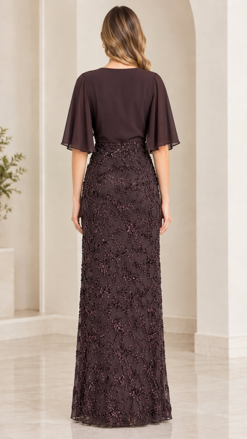 Back view of dark plum formal evening gown with V-back and full lace skirt