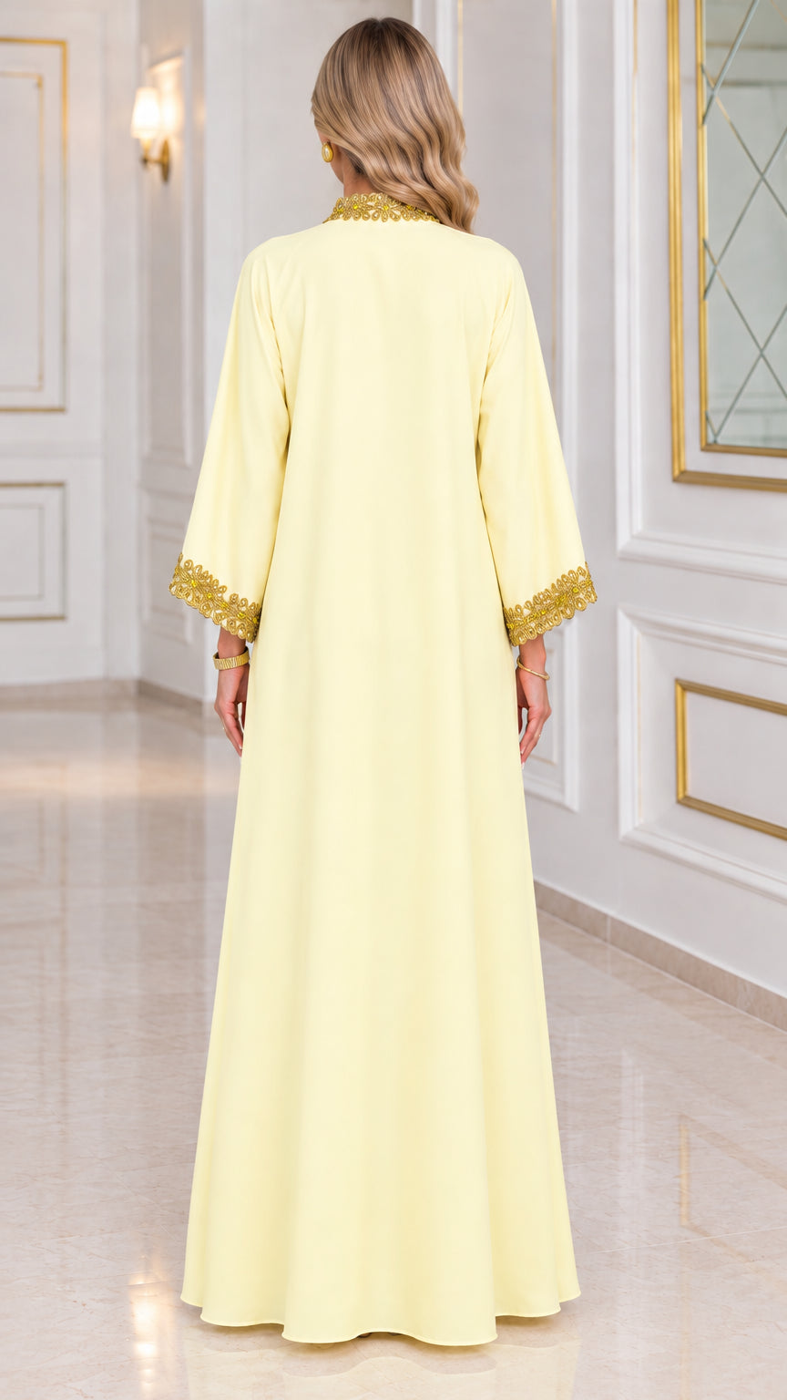 Back view of pale yellow flowing floor-length kaftan dress