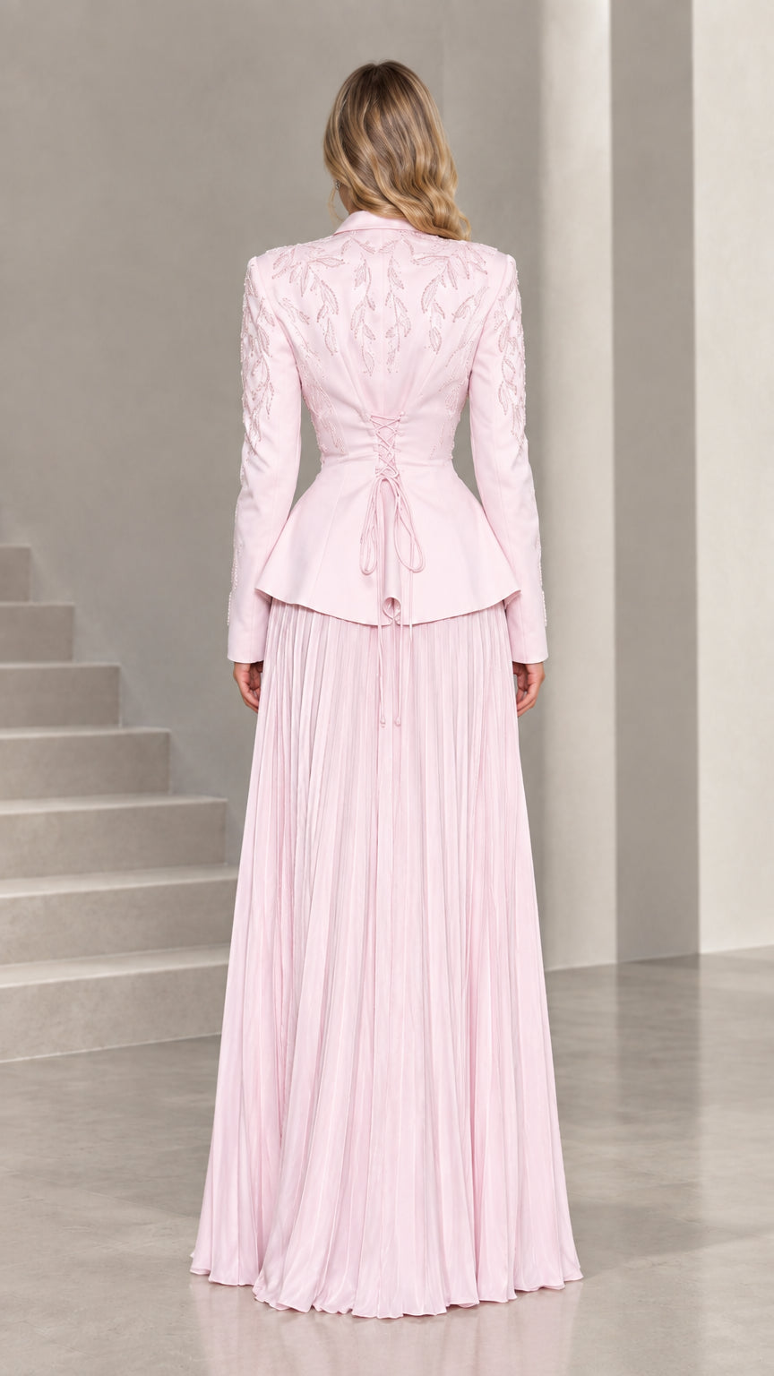 Back view of blush pink blazer showing adjustable corset lace-up waist detail