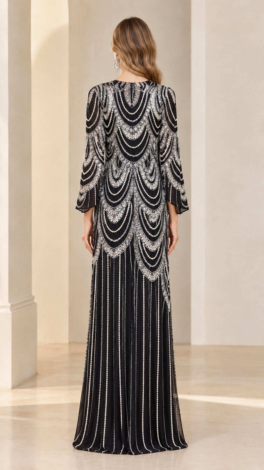 Back view of black sequin formal gown with scalloped embellishment detail