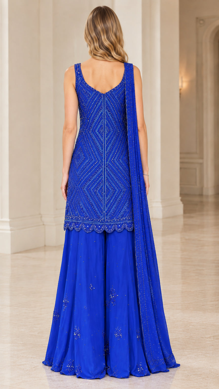 Back view of model wearing Royal Blue sleeveless beaded kurti and wide-leg sharara pants
