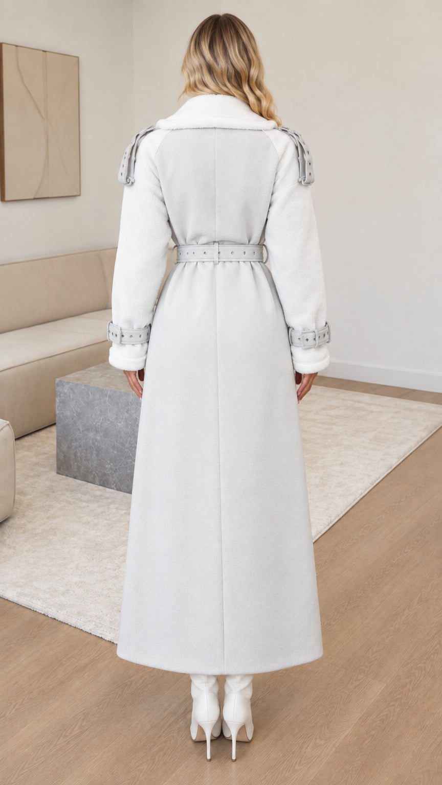 Back view of woman wearing belted light grey maxi overcoat