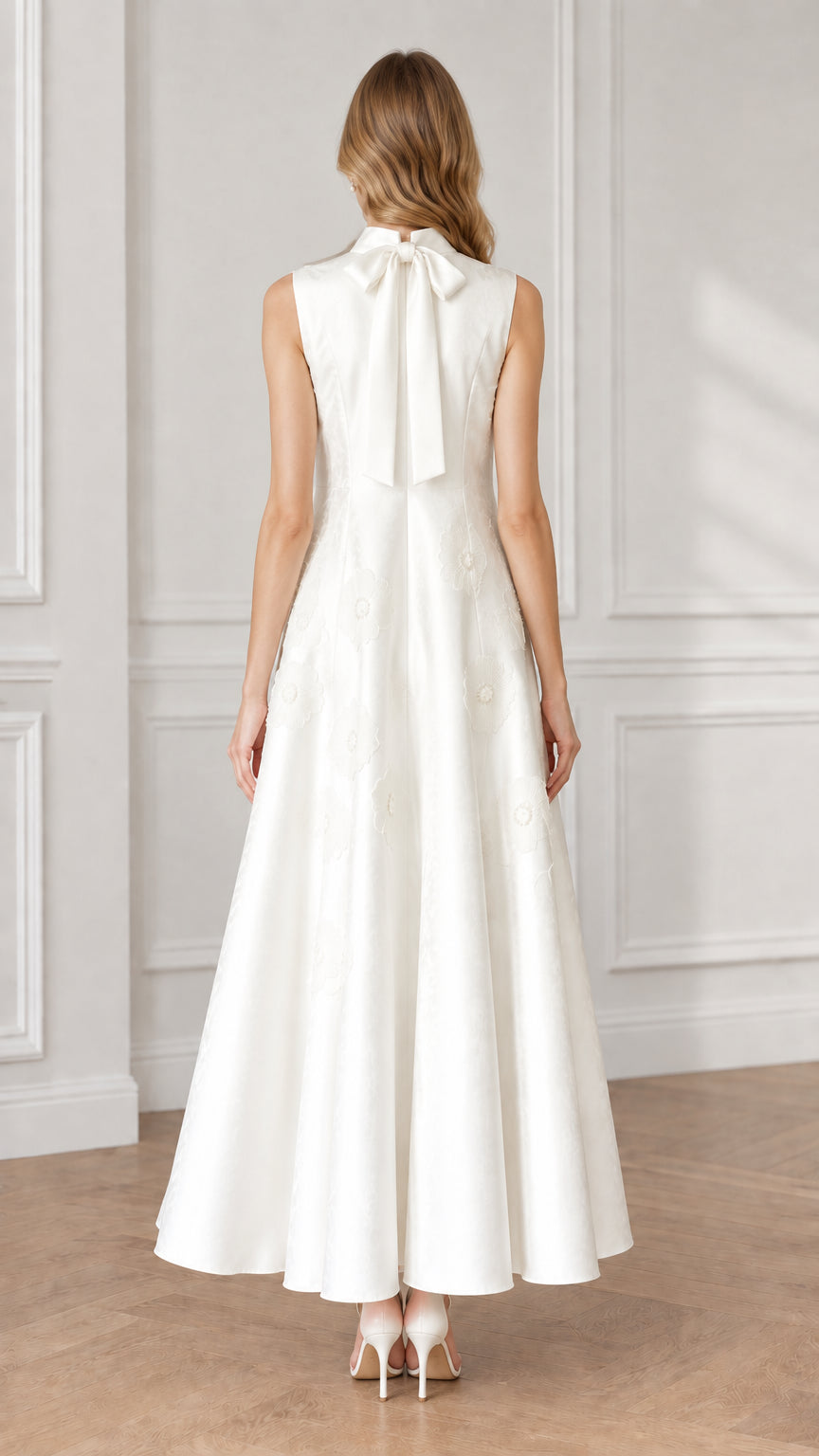 Back view of white maxi dress showing delicate back collar bow tie