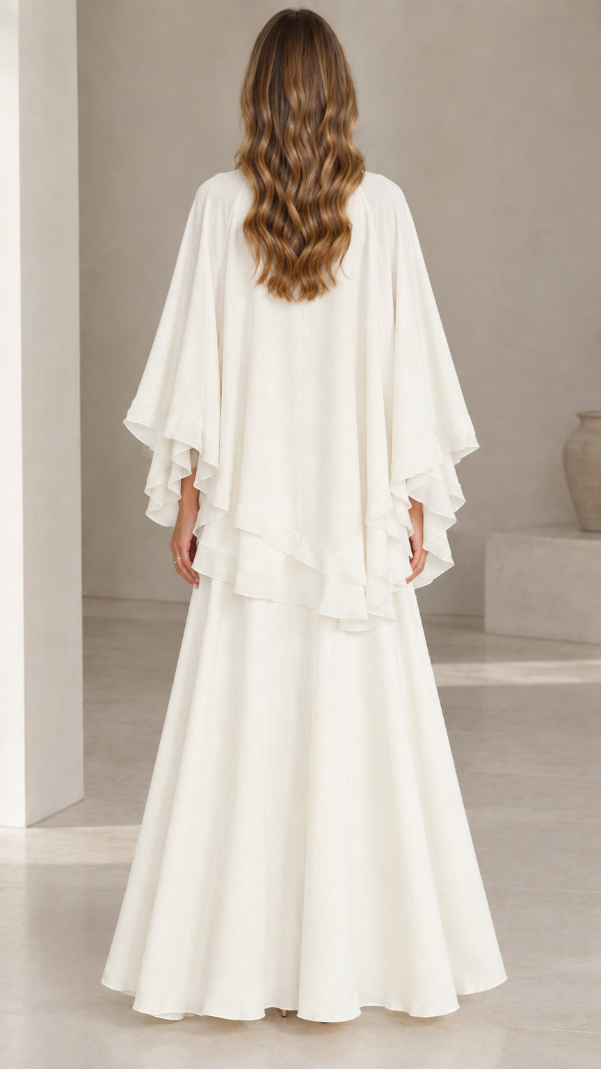 Back full-length view of ivory white capelet maxi dress set