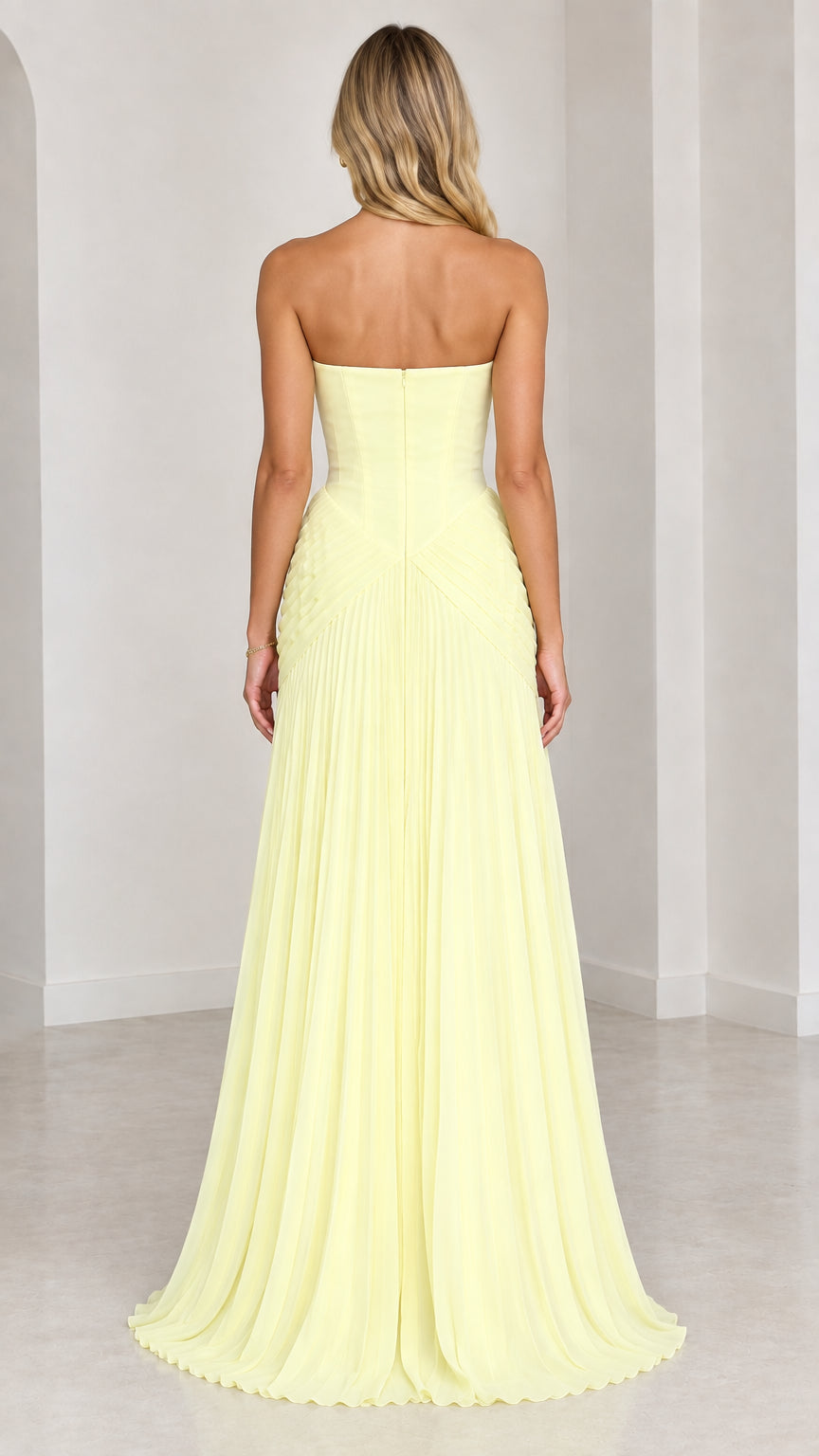 Back view of light yellow strapless floor length evening dress