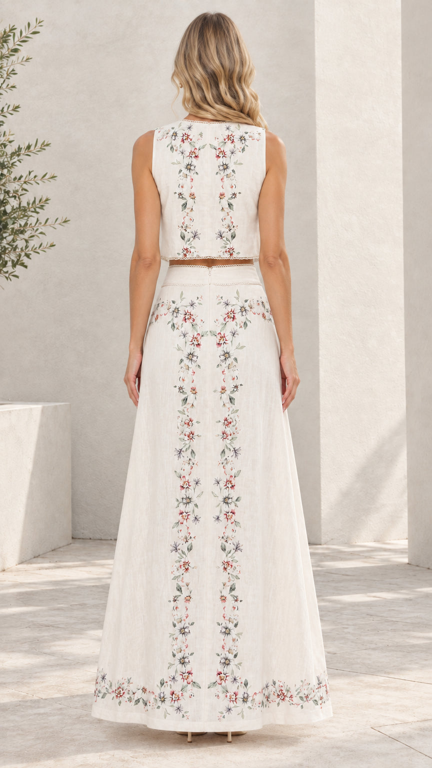 Back view of white floral embroidered crop top and flowing maxi skirt