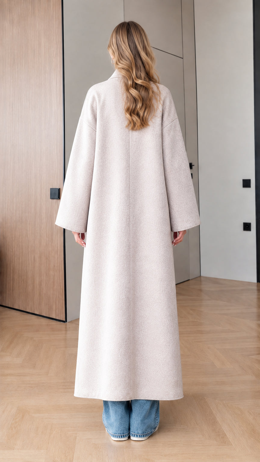 Back view of model showcasing the clean longline drape of Oatmeal duster coat