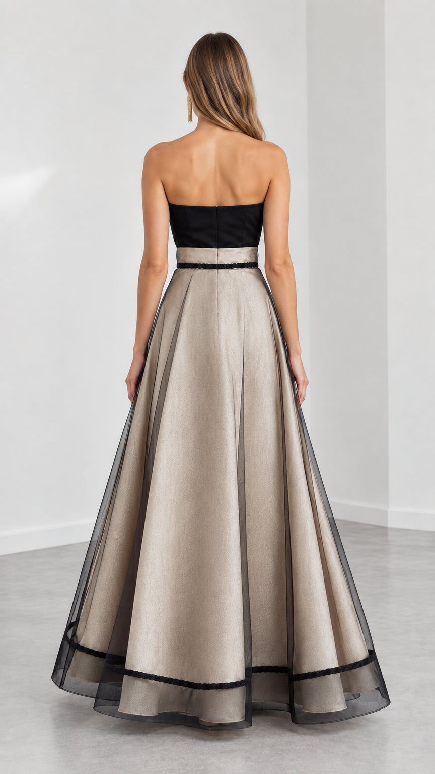 Back view of Champagne strapless evening gown showing zipper and full skirt