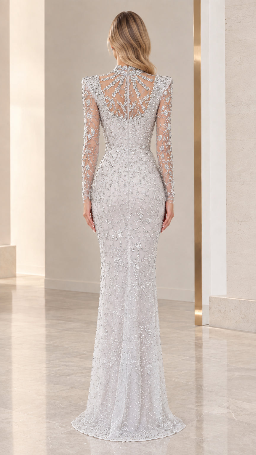 Back view of silver high neck illusion evening gown with sheer back panel