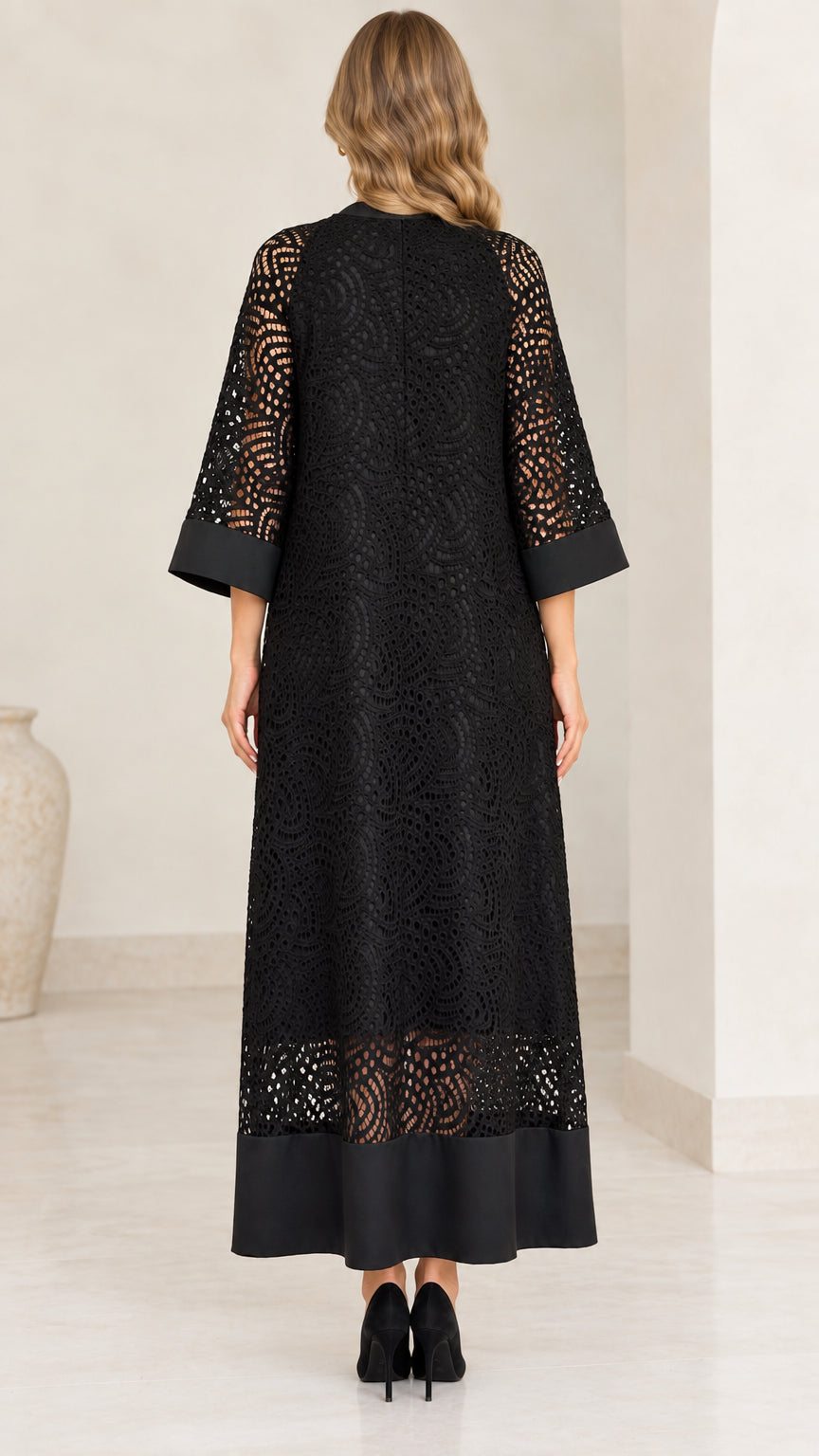 Back view of model in elegant black lace maxi dress