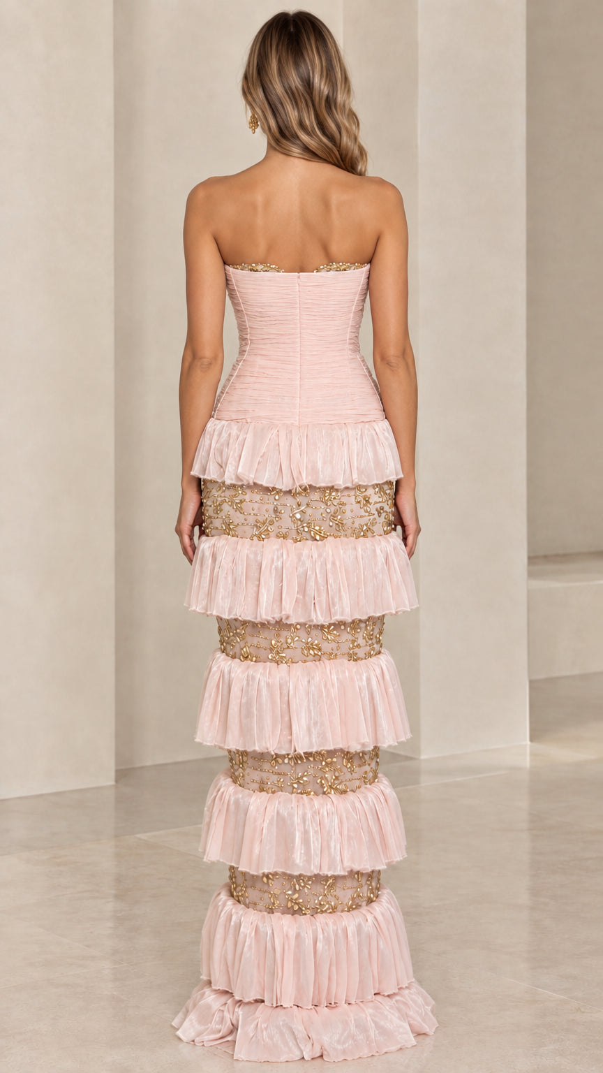 Back view of Blush Pink strapless column formal gown with layered ruffles
