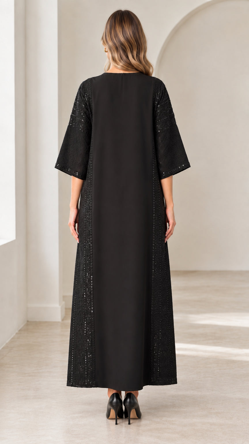 Back view of woman wearing long black modest maxi dress