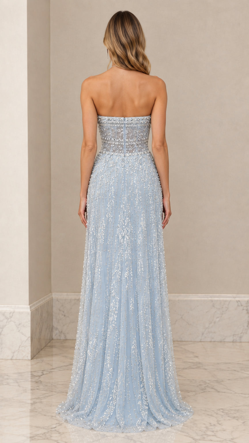 Back view of model in Light Blue strapless embellished floor-length gown