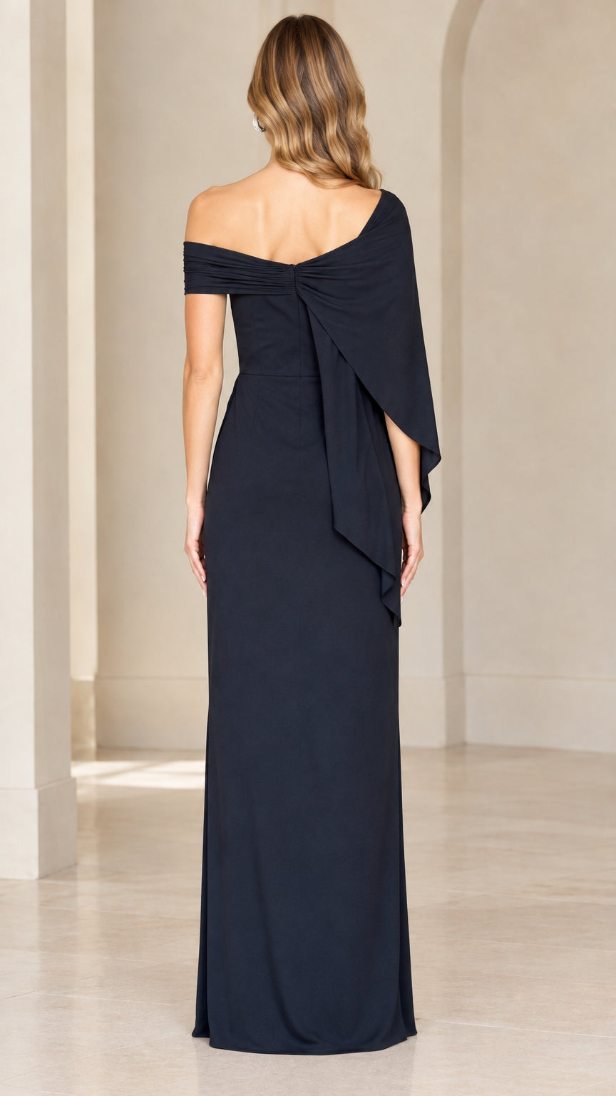 Back view of navy blue evening gown showing asymmetric drape detail