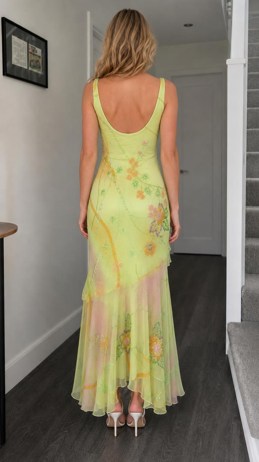Back view of yellow floral beaded mesh maxi dress showing scoop back