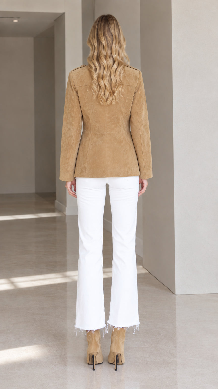 Back view of woman wearing tailored Camel faux suede jacket