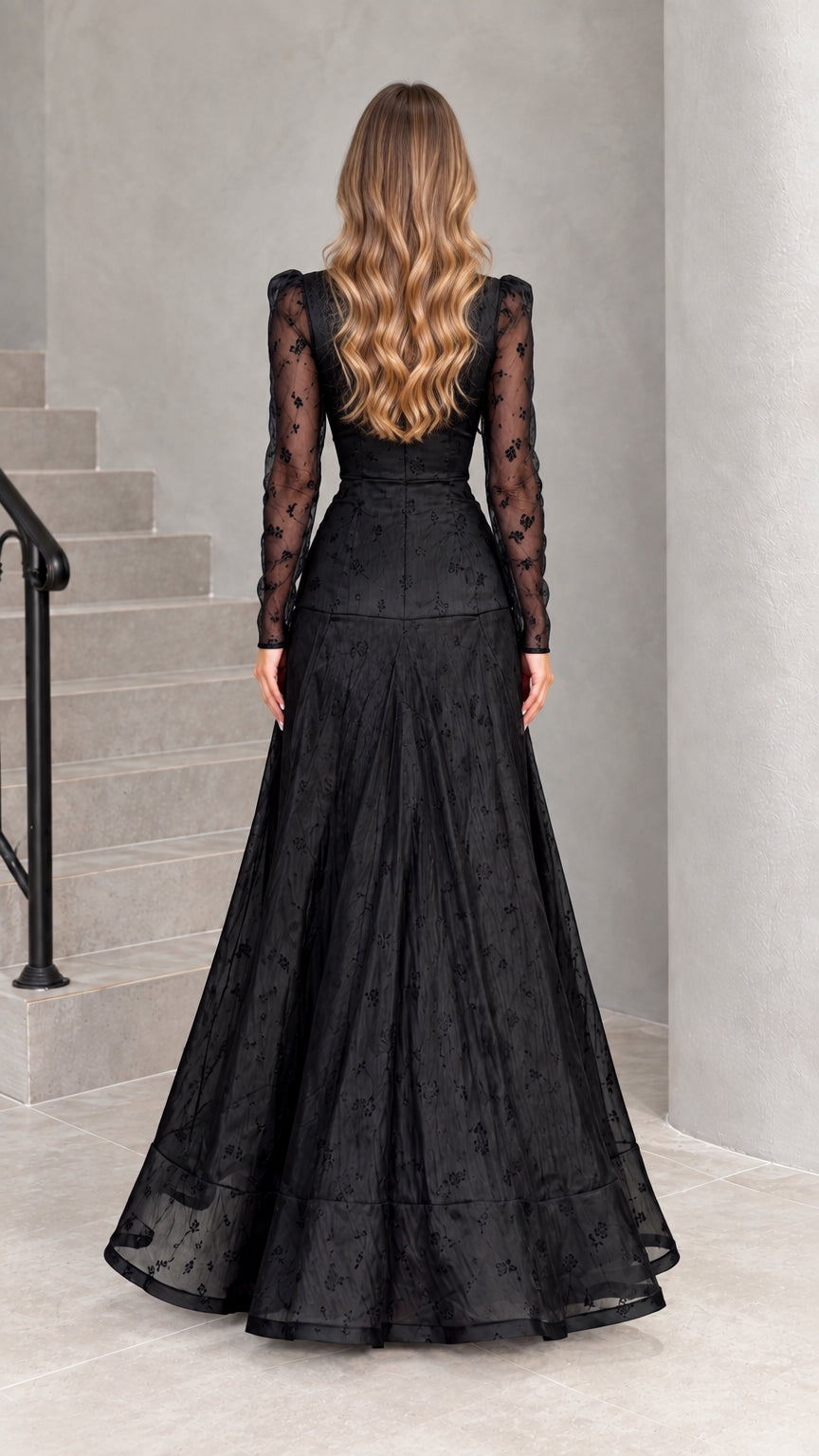 Back view of black floor-length formal gown showing hidden zipper