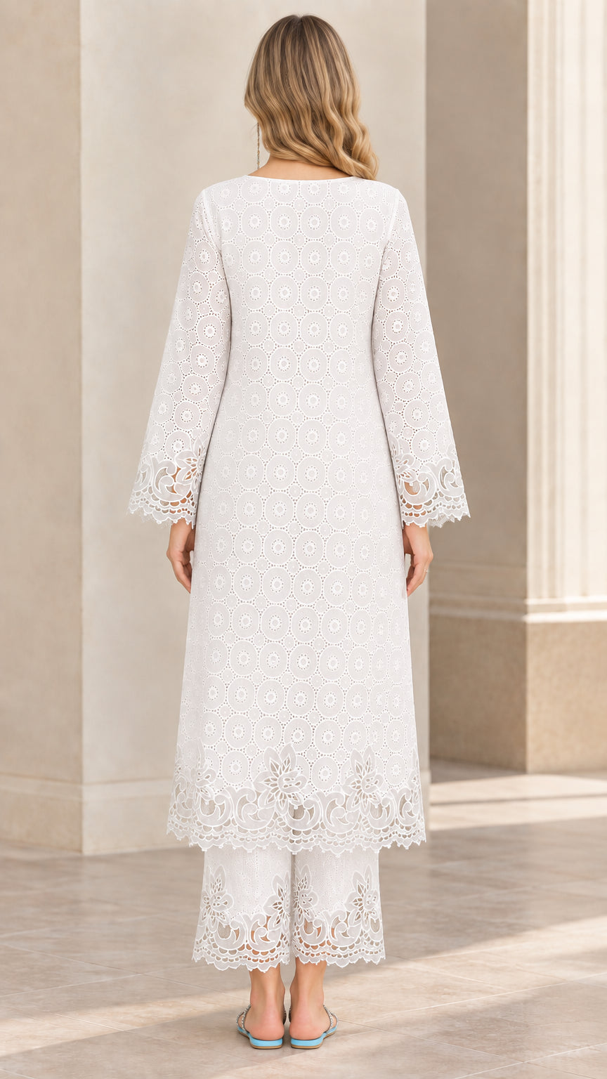 Back view of woman wearing white lace-trimmed longline tunic and cropped trouser set