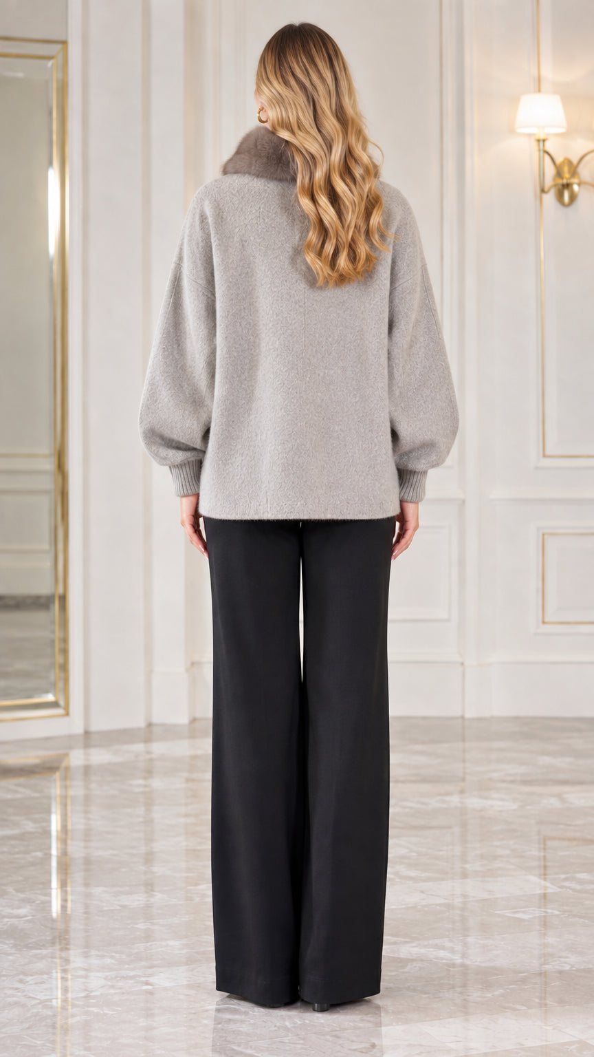 Back view of woman wearing heather grey knit cardigan jacket